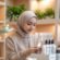 young-indonesian-woman-packing-skincare-orders-professional-attire